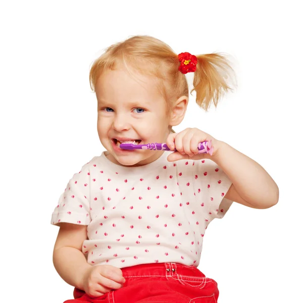 Sevimli küçük kız diş fırçalama. — Stok fotoğraf