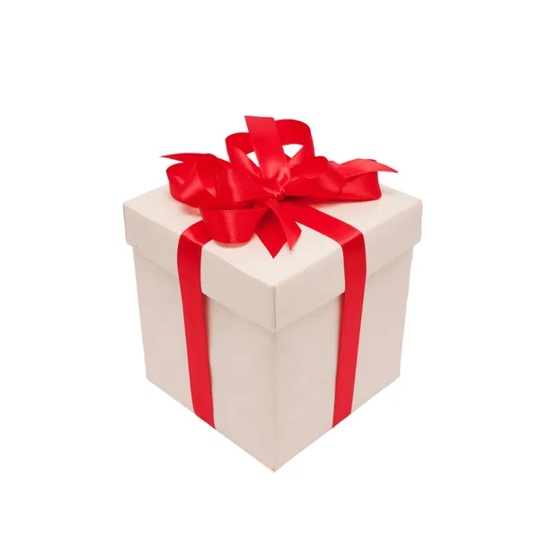 Festive gift. Beige box and red satin bow. — Stock Photo, Image