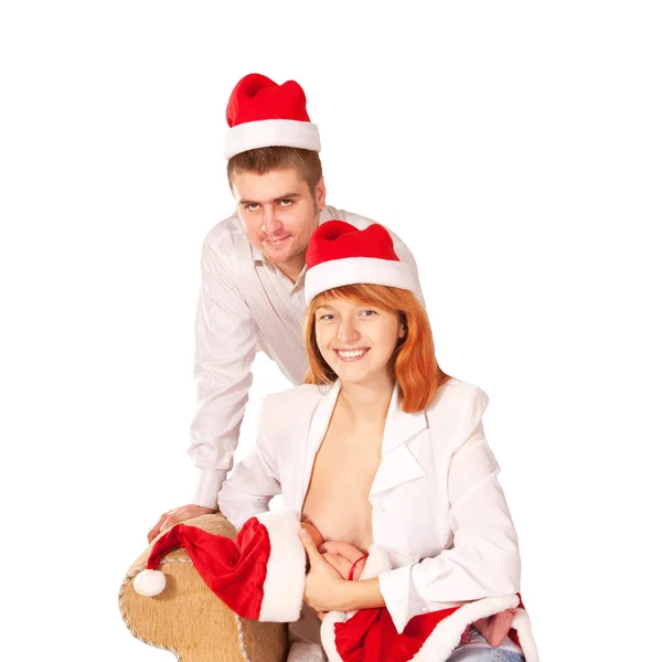Zelfgemaakte christmas. gelukkige familie in santa claus — Stockfoto