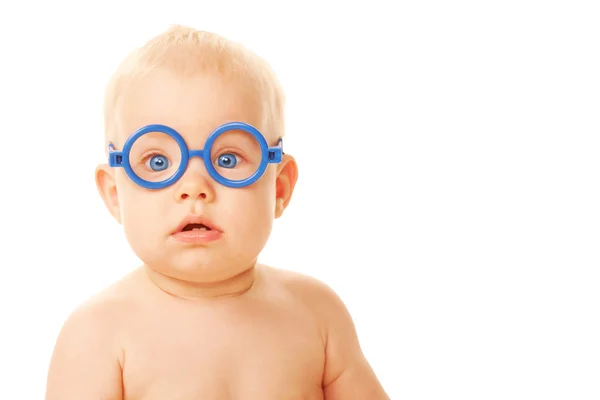 Baby in glasses looking at something — Stock Photo, Image