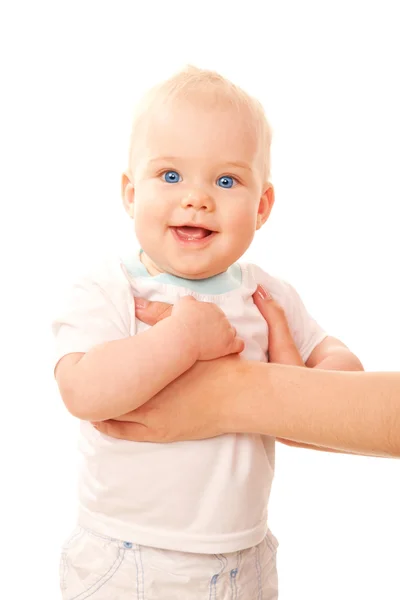 Happy blue-eyed baby standing with mother's arms — Stock Photo, Image