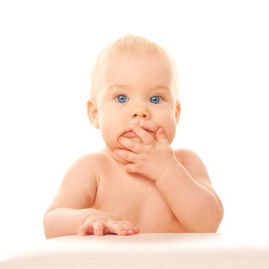 Lovely baby closing mouth with his hand. clipart