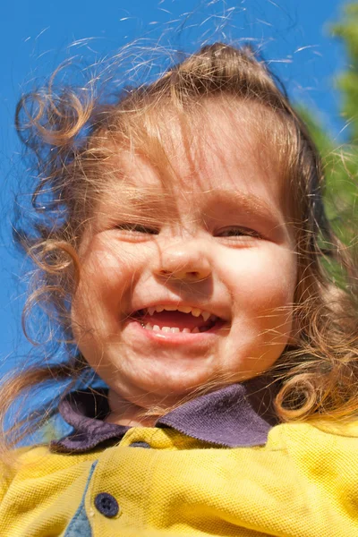 Smiling little child against the sky — Stock Photo, Image