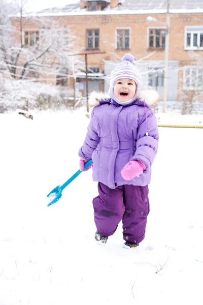 Child playing with snow — Stock Photo, Image