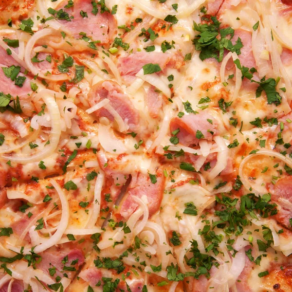 Pizza with ham, onions, cheese and herbs — Stock Photo, Image