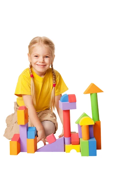Happy little child is constructing houses Stock Photo