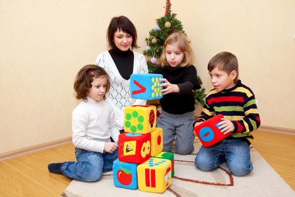 Family building with blocks at home. — Stock Photo, Image