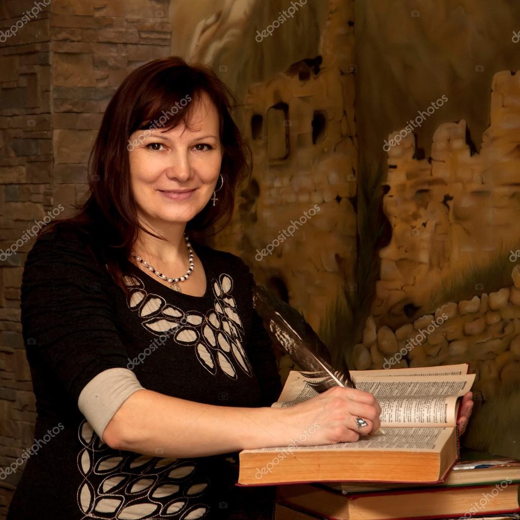 Pretty woman writing a book. — Stock Photo © Vitalinka #21293259