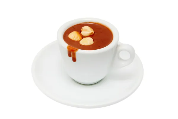 Uma xícara de chocolate quente com nozes . — Fotografia de Stock