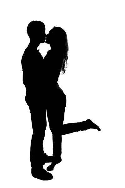 Silhouette of a young couple in love. — Stock Photo, Image