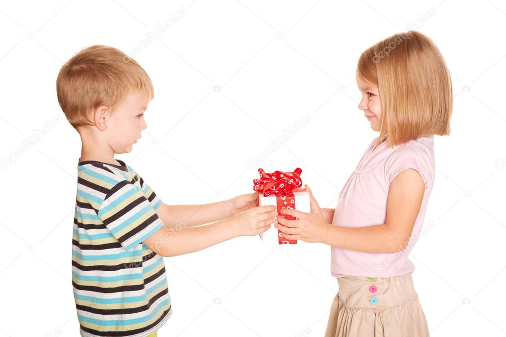 Little boy giving a little girl a gift. — Stock Photo © Vitalinka 28603437