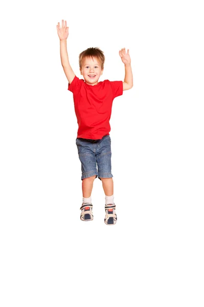 Glücklicher kleiner Junge springt. isoliert auf weiß — Stockfoto