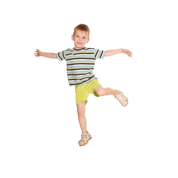 Kleiner Junge im gestreiften T-Shirt tanzt. — Stockfoto