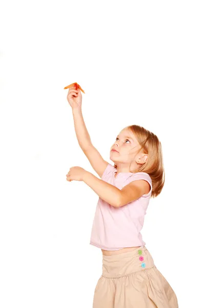 Niña lanzando avión de papel — Foto de Stock