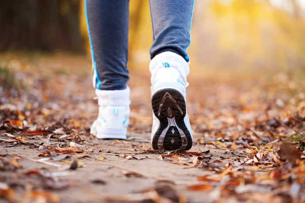 Close up running feet in trainers. — Stock Photo, Image