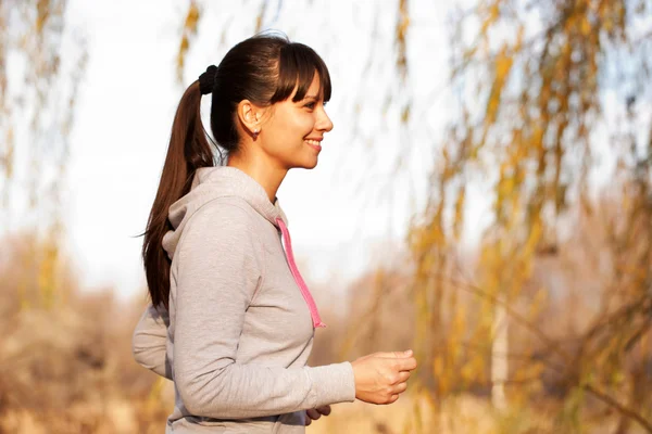 Woman running at sunset. Healthy lifestyle concept. — Stock Photo, Image