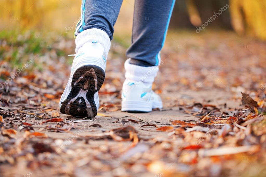 Close-up running feet in trainers of female runner. Healthy lifestyle, fitness, jogging, active, young concept, ready for your logo, text or symbols.