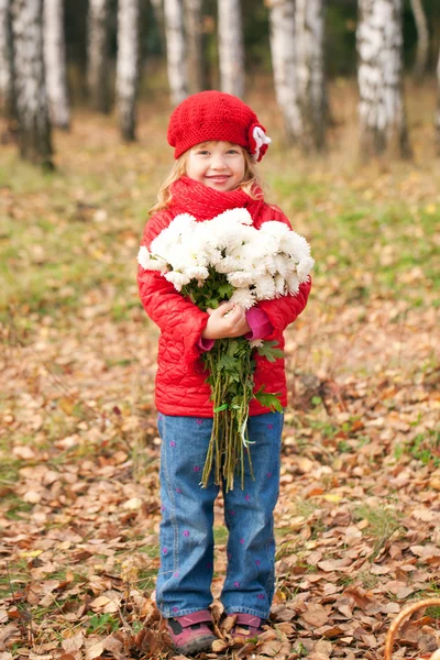 Smiling little kid with bouquet — Stock Photo, Image