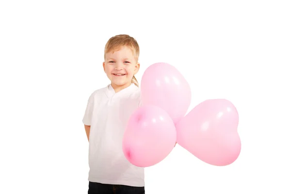Boy playing with heart balloons, giving them — Stock Photo, Image