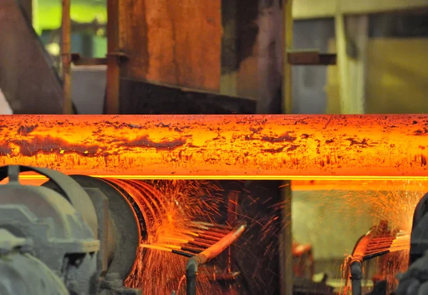 Hot steel on conveyor — Stock Photo, Image