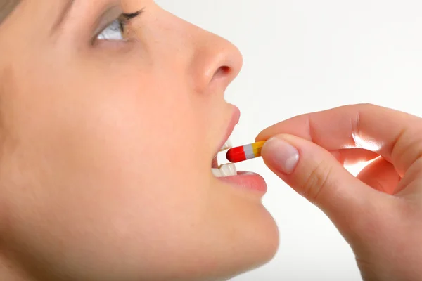 Woman taking pills — Stock Photo, Image