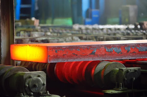 Hot steel on conveyor — Stock Photo, Image