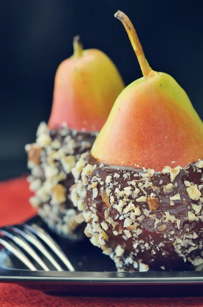 Two fresh pear with chocolate icing — Stock Photo, Image