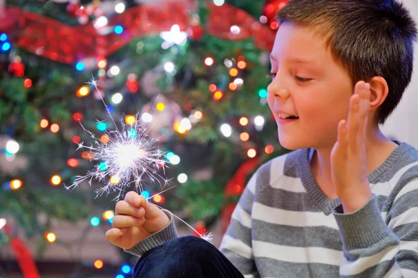 Portrait of boy looking at fire sparks — Stock Photo, Image