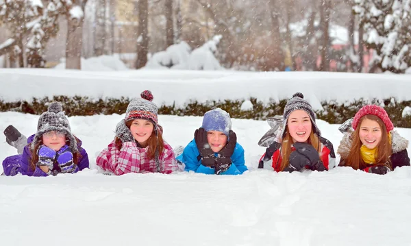 Children on snow in winter time — Stock Photo, Image