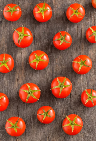 Cherry tomatoes on vintage wooden table — Stock Photo, Image