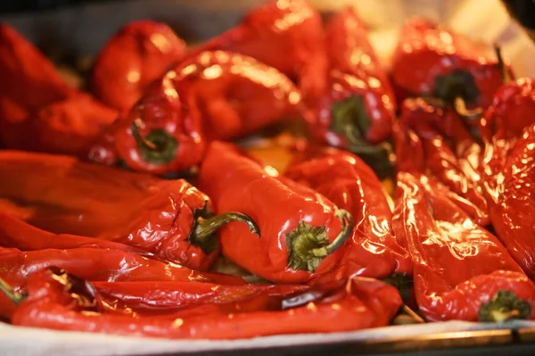 Red tasty peppers roasted in oven