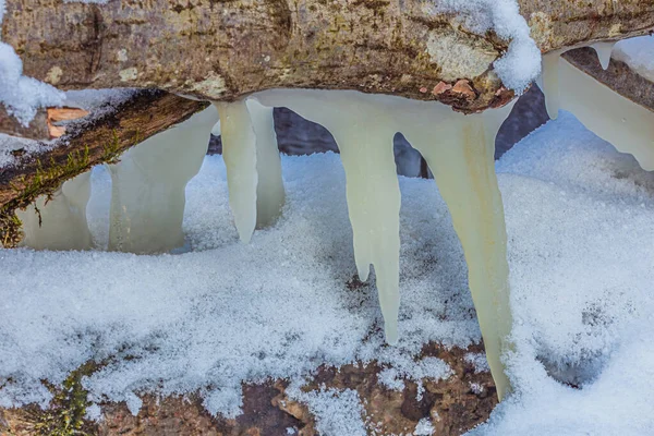 Icicles at winter, cold weather with icicles over river stream — Stock Photo, Image