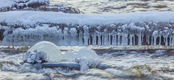 Icicles at winter, cold weather with icicles over river stream — Zdjęcie stockowe