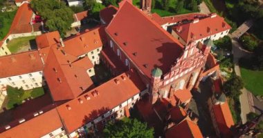 Vilnius, Lithuania. Roman Catholic Church Of St. Anne And Church Of St. Francis And St. Bernard In Old Town In Summer Sunny Day. UNESCO World Heritage ,aerial video