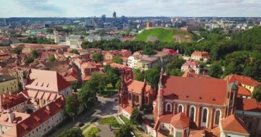 Vilnius, Lithuania. Roman Catholic Church Of St. Anne And Church Of St. Francis And St. Bernard In Old Town In Summer Sunny Day. UNESCO World Heritage ,aerial video