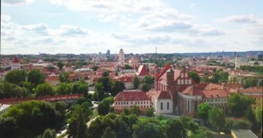 Vilnius, Lithuania. Roman Catholic Church Of St. Anne And Church Of St. Francis And St. Bernard In Old Town In Summer Sunny Day. UNESCO World Heritage ,aerial video