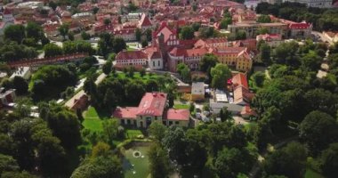 Vilnius, Lithuania. Roman Catholic Church Of St. Anne And Church Of St. Francis And St. Bernard In Old Town In Summer Sunny Day. UNESCO World Heritage ,aerial video