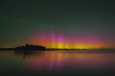 Northern lights - Aurora borealis over the lake, Lithuania