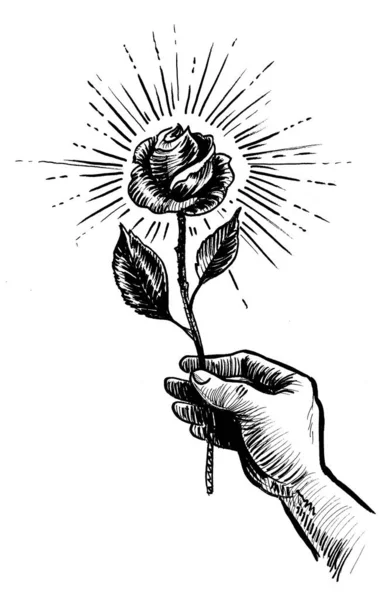 Hand with rose flower. Ink black and white drawing