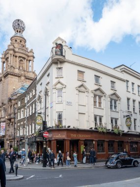 London, UK-29.10.21: people walking past The Chandos Pub on the crossroad of William IV Street and St. Martin's Lane