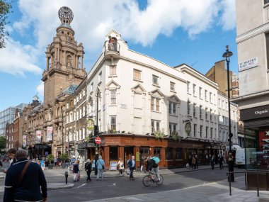 London, UK-29.10.21: people walking past The Chandos Pub on the crossroad of William IV Street and St. Martin's Lane