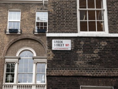 London, UK-09.10.21: Greek Street name sign, City of Westminster, London, UK