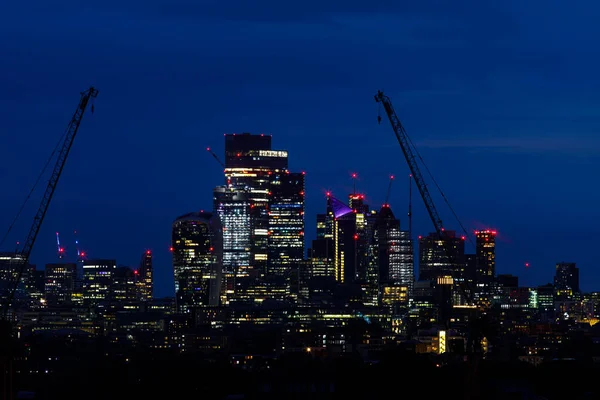 Scenic view of the City of London at nightas seen from the South. The City is the primary central business district of London and the world