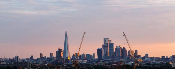 Panoramic view of the City of London in the early morning as seen from the South at the down. The City is the primary central business district of London
