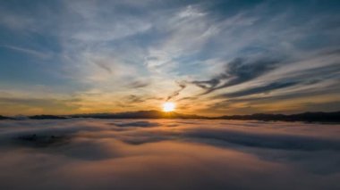 4K Hyperlapse aerial view drone flying over sea of fog at sunrise, Khoa Khai nui mountain, Phang Nga, Thailand