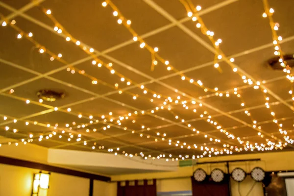 Background, lights on the brown wall of the office — Stock Photo, Image