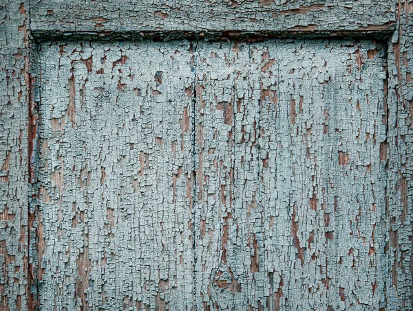 Wand mit rissiger Farbe beschmiert — Stockfoto