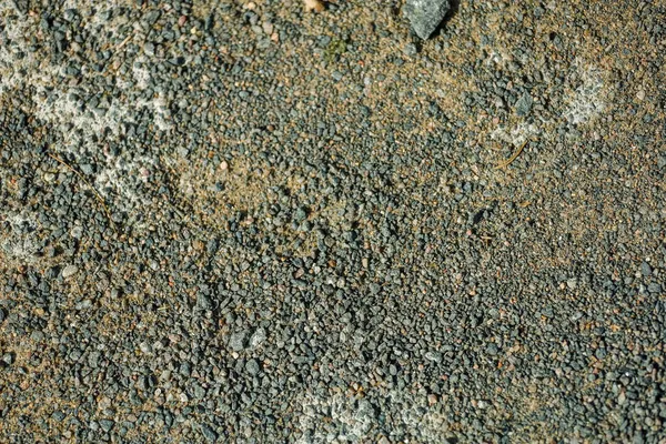 Fundo, pequenas pedras de cor cinza no chão — Fotografia de Stock