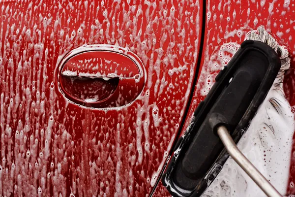 Cleaning the car at jetwash — Stock Photo, Image