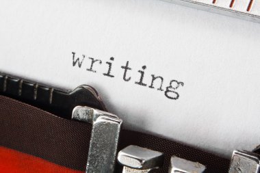 writing text on retro typewriter clipart